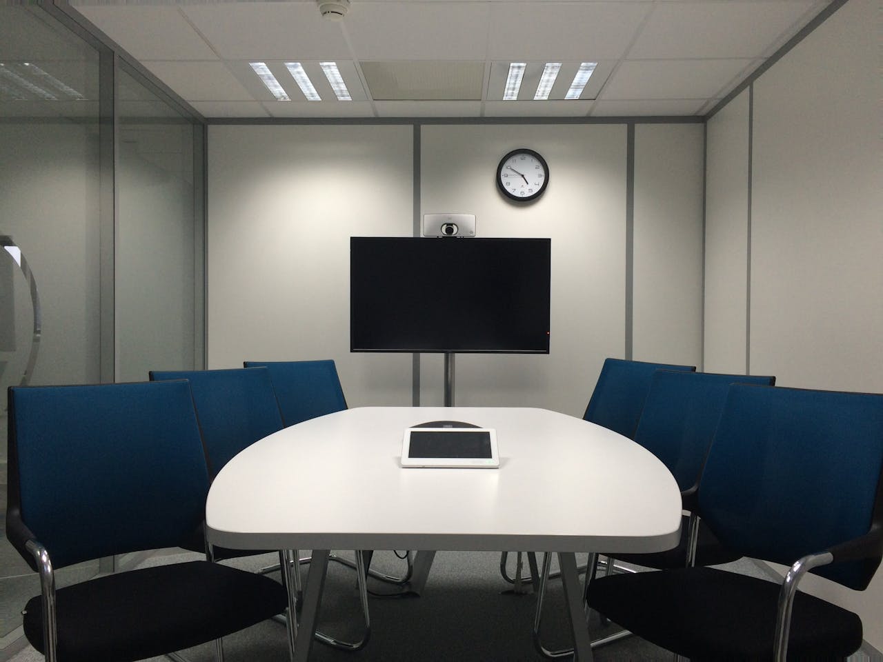 Modern boardroom using integrated control systems for seamless meeting management and audiovisual control